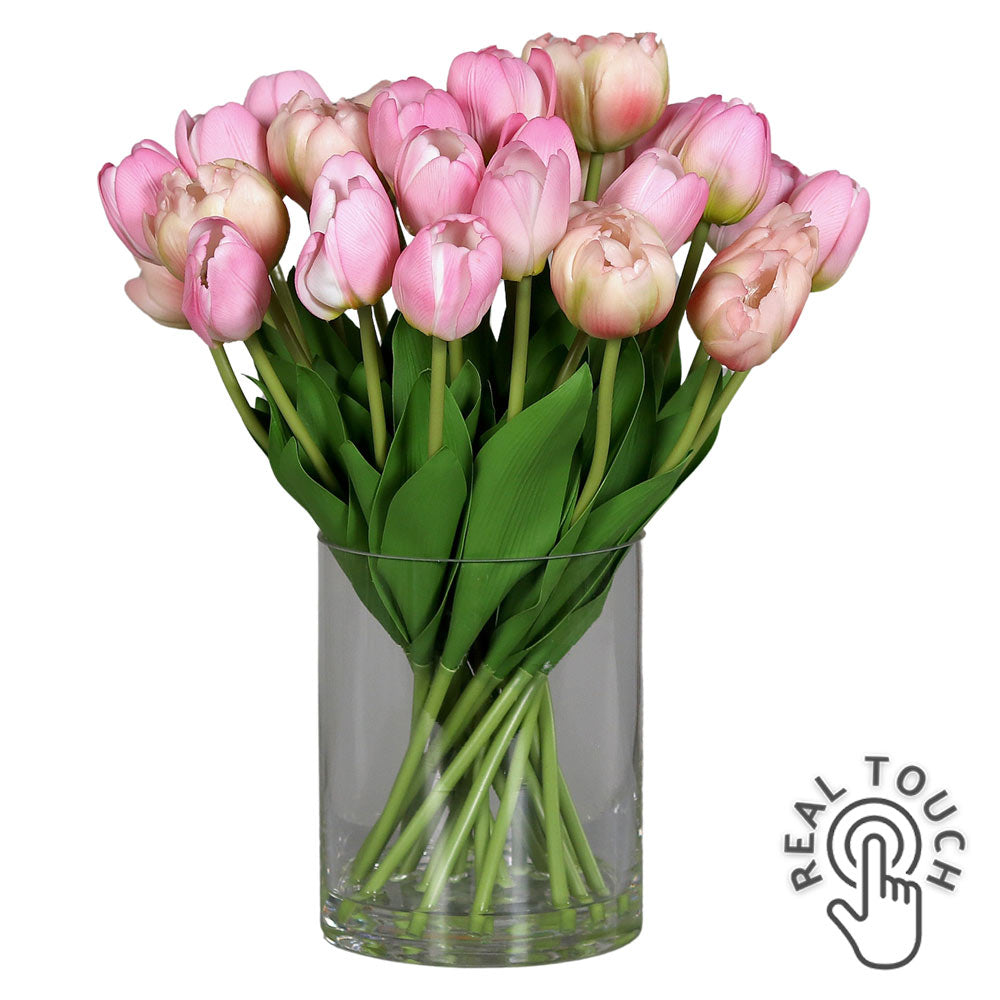 Mű tulipán csokor, henger formájú üvegvázában. Mű tulipán csokor, henger formájú üvegvázában.