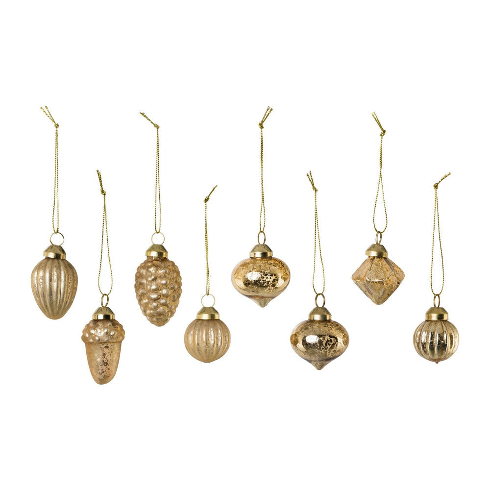 Patinás felületű, antikolt aranyszínű, többféle formájú, 8 darabos karácsonyfadísz szett.