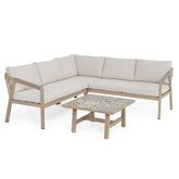 Kalimera L alakú kültéri sarokgarnitúra törtfehér párnákkal és porceláncsempés dohányzóasztallal