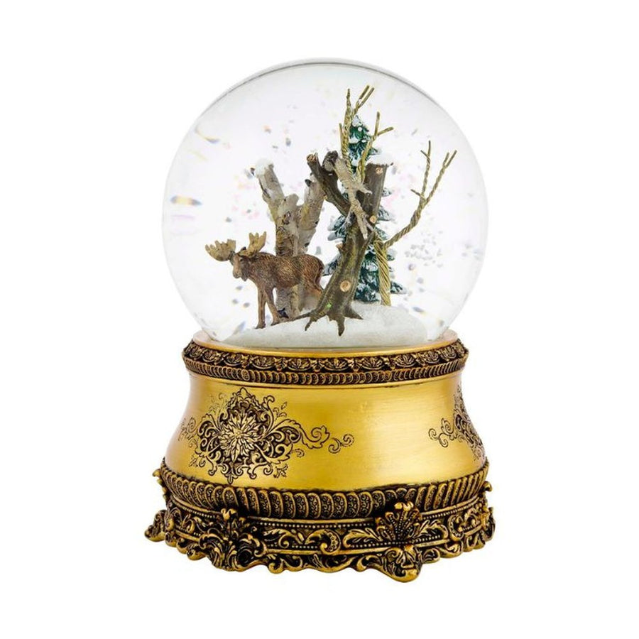 Christmas music box snow globe with a moose and pine tree inside a gold ornate base, 15 cm tall.