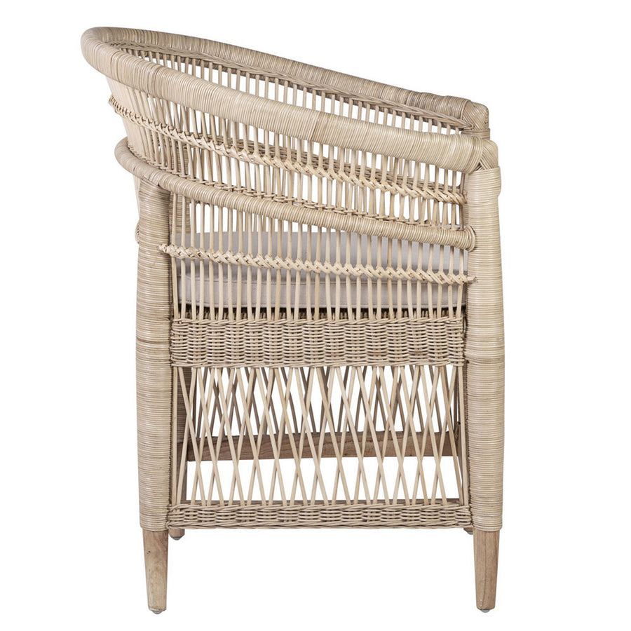 Rear view of a natural rattan armchair with lattice sides and tapered wooden legs