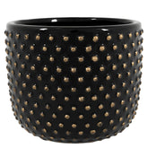 Modern stílusú, fekete színű, mázas kerámia kaspó aranyszínű, pöttyös dombormintával