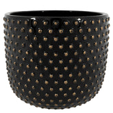 Modern stílusú, fekete színű, mázas kerámia kaspó aranyszínű, pöttyös dombormintával
