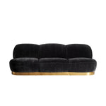 Modern art deco stílusú, fekete színű bársonnyal kárpitozott kanapé.