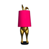 Aranyszínű, nyuszi formájú, glamour stílusú díjnyertes asztali lámpa rózsaszín búrával.