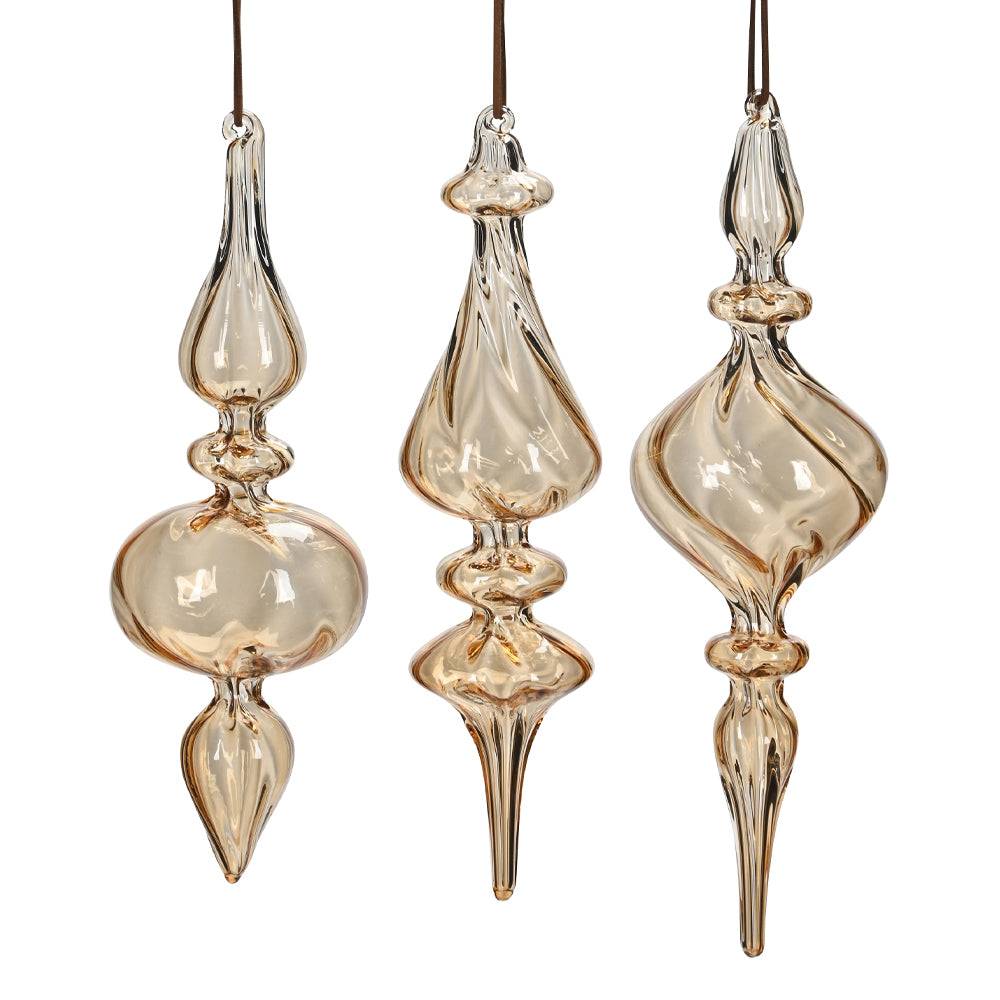 Három darab borostyánsárga, kézzel fújt üveg jégcsap karácsonyfadísz szett, különböző elegáns formákkal.
