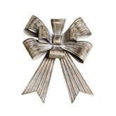 Rézszínű, fémből készült karácsonyi dekor masni.