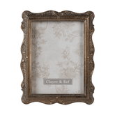 Aranyszínű asztali fényképtartó.