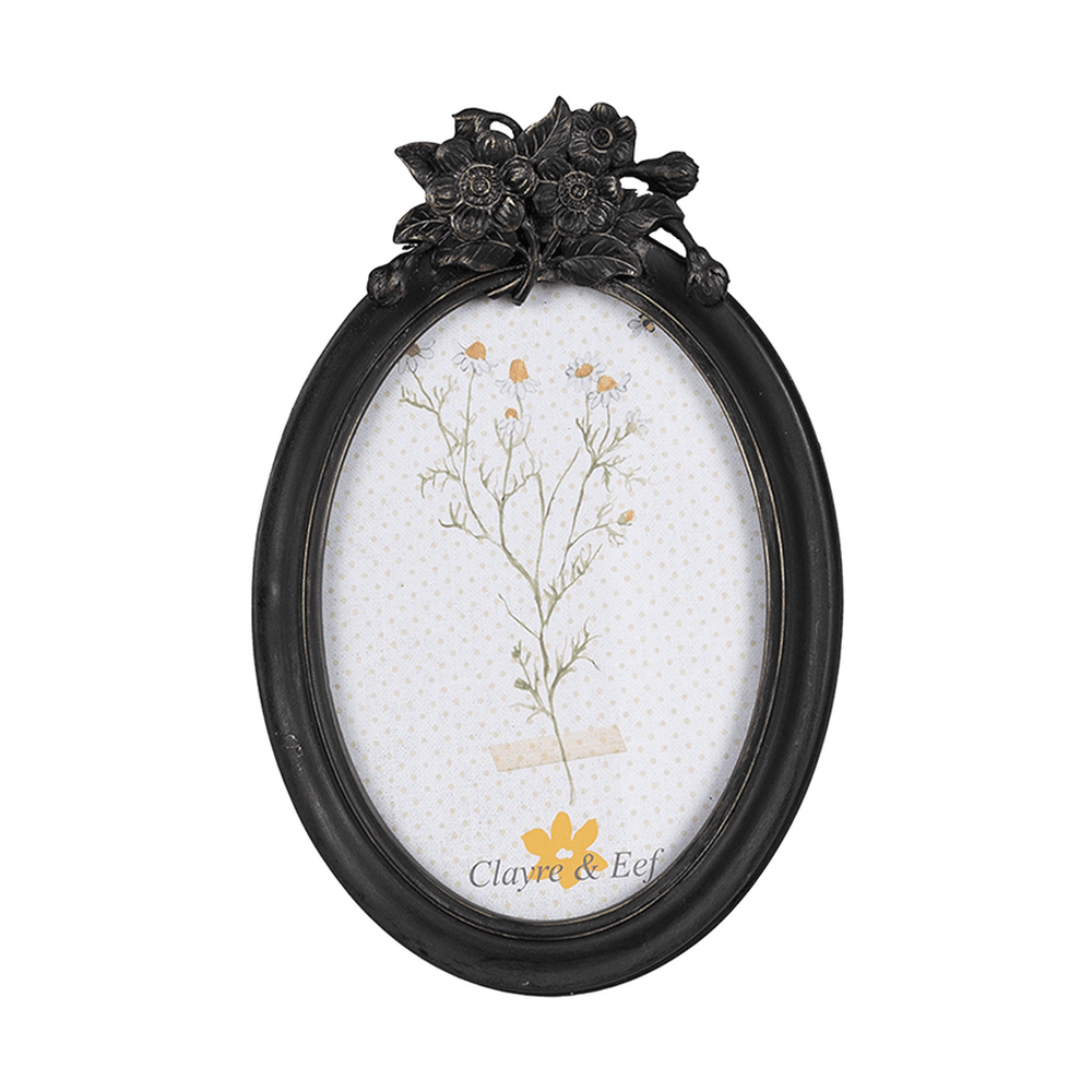 Fekete színű, ovális formájú fényképtartó.