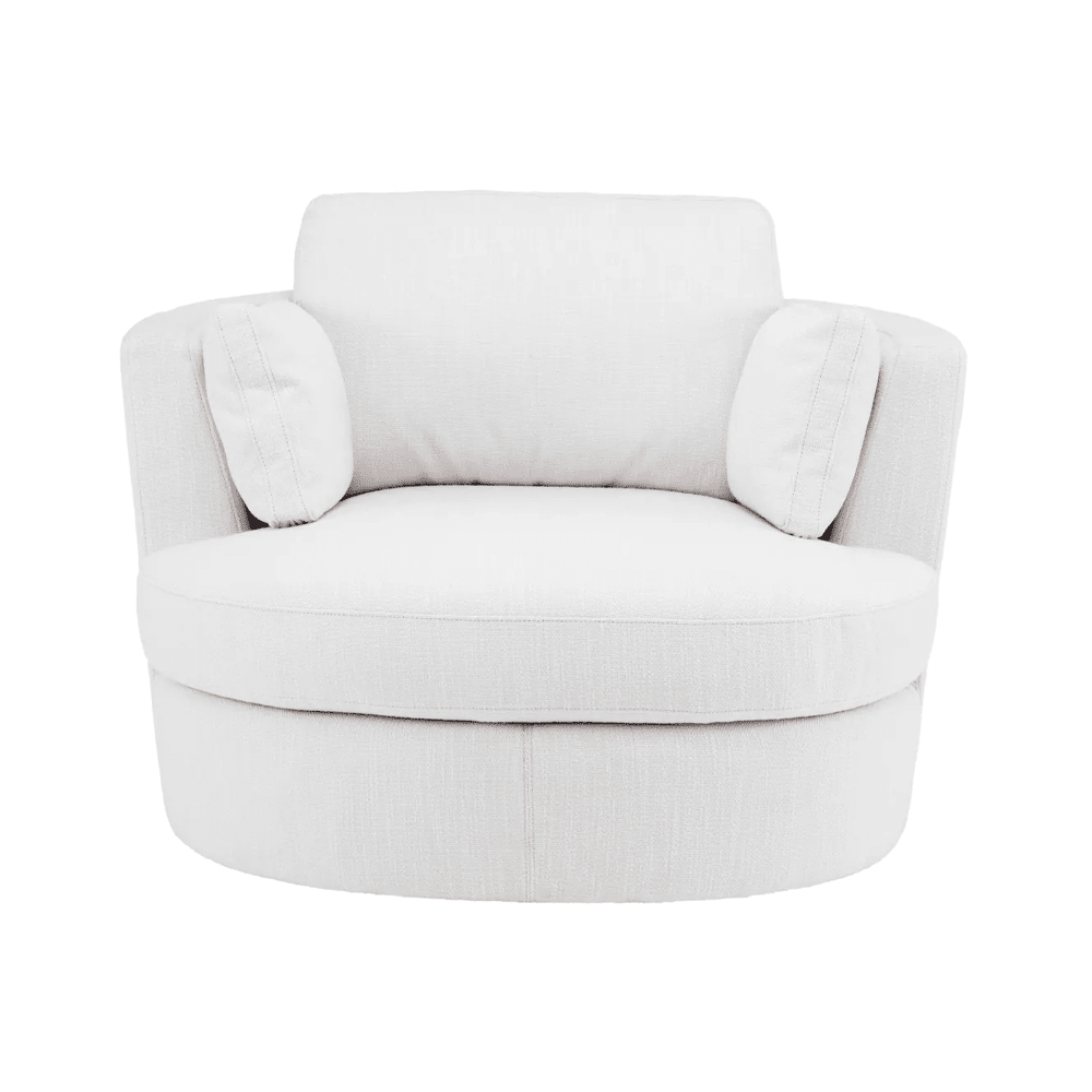 Fehér, szövetkárpitozású, forgó design fotel elölről, párnákkal.