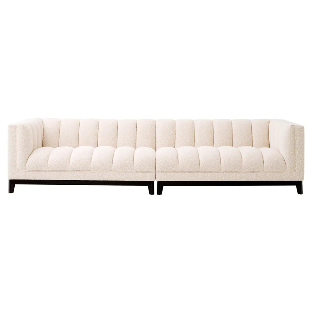 Krémszínű buklé szövettel kárpitozott, prémium minőségű, formatervezett design kanapé.