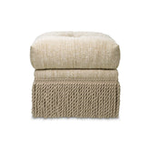 Krémszínű buklészövettel kárpitozott puff.