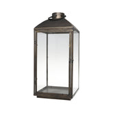 Rézszínű, fémből készült kézműves lámpás.