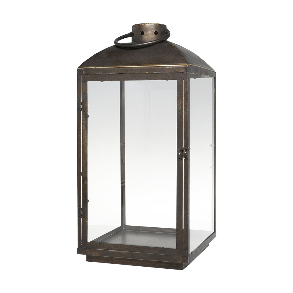 Rézszínű, fémből készült kézműves lámpás.