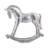 Antikolt felületű, ezüst színű karácsonyi hintaló figura.