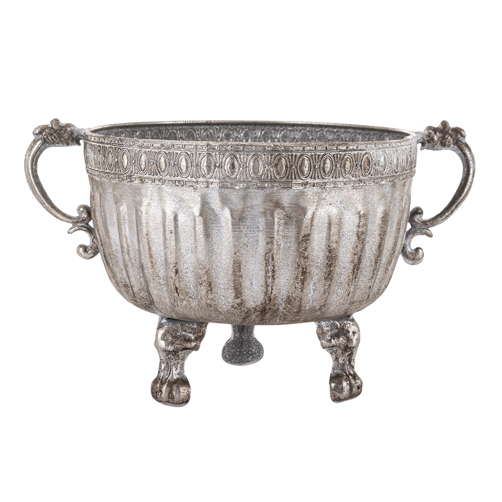 Ezüstszínű, dombormintával díszített, lábakon álló fém kaspó tál.