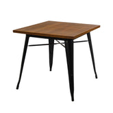 Fekete színű, fémből készült, fa fedlappal kialakított bisztróasztal.