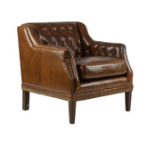 Antikolt, dohánybarna bőrfotel előnézeti képe szögből fotózva, gombdíszítéses háttámlával és szegecselt részletekkel, a Hampton kollekcióból