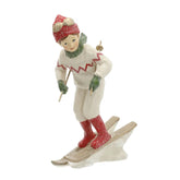 Heritage fehér karácsonyi síelő kisfiú figura elölnézetből, piros sapkában és síléceken