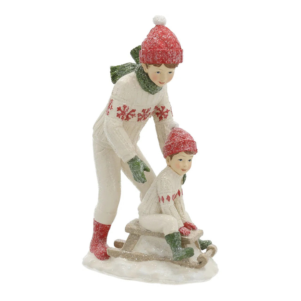 HERITAGE fehér karácsonyi szánkózó kisfiú figurák 19 cm – elölnézet