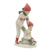 HERITAGE fehér karácsonyi szánkózó kisfiú figurák 19 cm – elölnézet