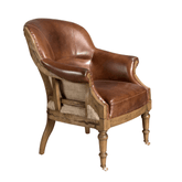 Konyakbarna színű cserzett marhabőrrel kárpitozott desing fotel.