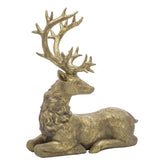 Aranyszínű karácsonyi szarvas figura.