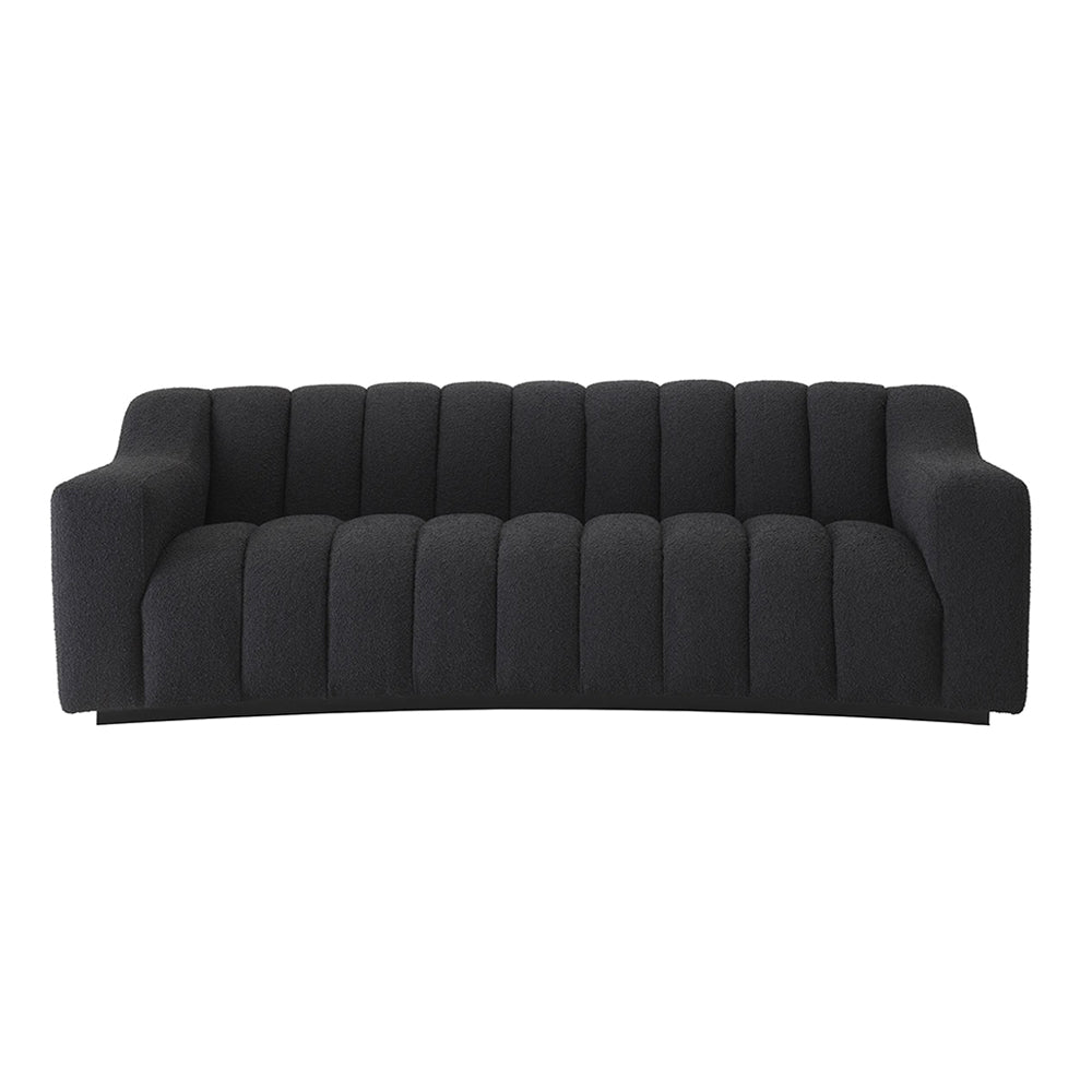 Fekete színű buklé szövettel kárpitozott dizájn kanapé.
