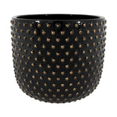 Fekete színű, mázas kerámiából készült kaspó.