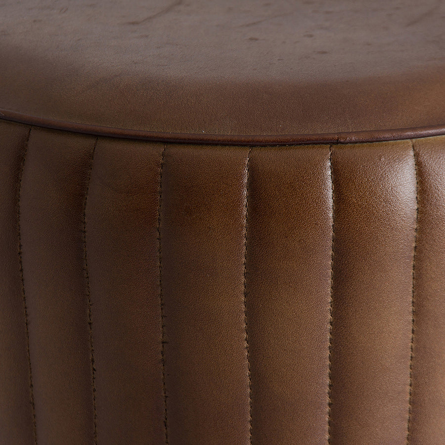 Close up of brown quilted leather seat on the SENEY 79 cm loft bar stool
