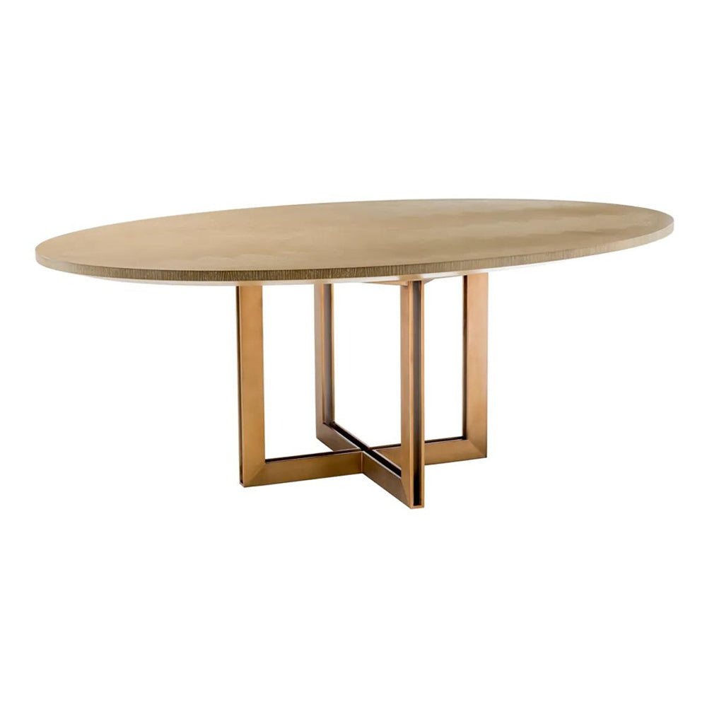 Natúrszínű tölgyfurnérból és sárgaréz felületű rozsdamentes acélból készült, ovális formájú design étkezőasztal.