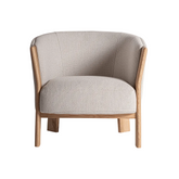 Bézs színű design fotel.