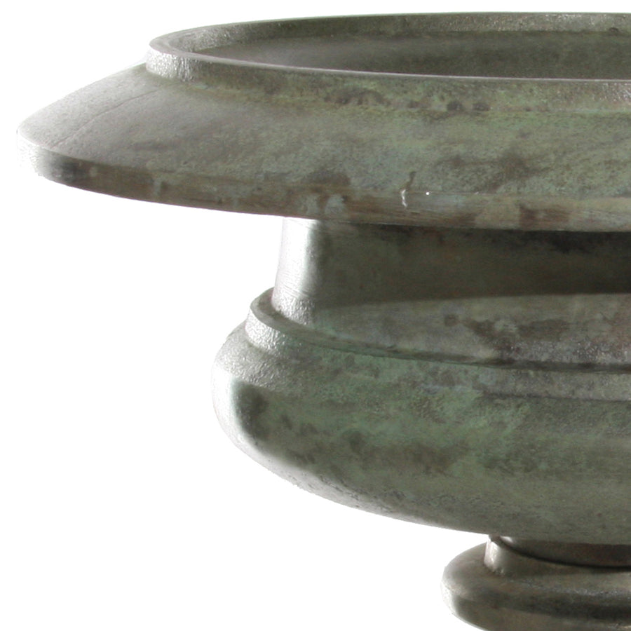 Close up of a green patina aluminum planter with a wide rim from the Oana collection