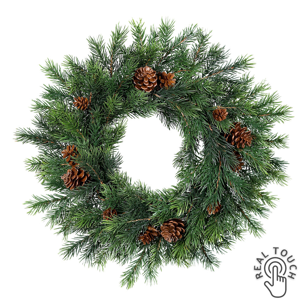 Sötétzöld színű, mű lucfenyő koszorú.