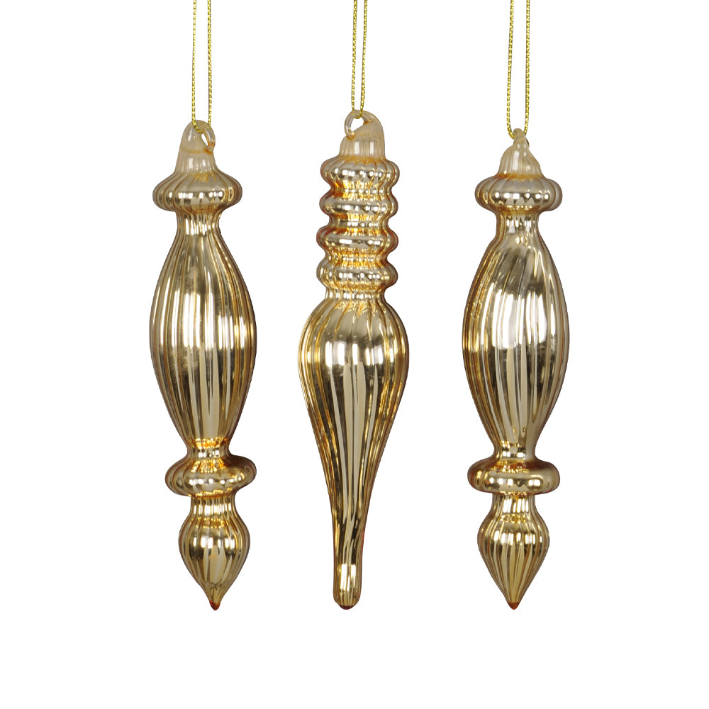 3 darab aranyszínű üveg karácsonyfadísz szett fehér háttér előtt.