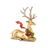 Aranyszínű karácsonyi szarvas figura.
