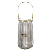 Bordázott üvegből és aranyszínű alumíniumból készült mécsestartó.