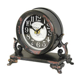 Antikolt felületű fém asztali óra.