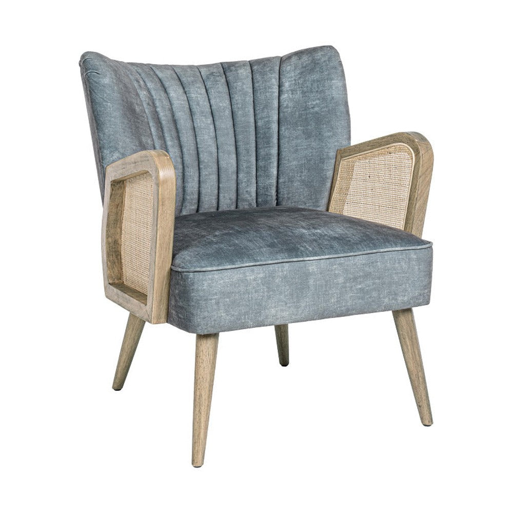 Retró stílusú, világoskék bársonyhatású szövettel kárpitozott kaucsukfa klubfotel.