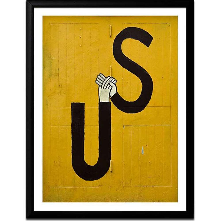 Jean Jullian Us artwork photo print in a black glazed frame with bold yellow background and black Us lettering