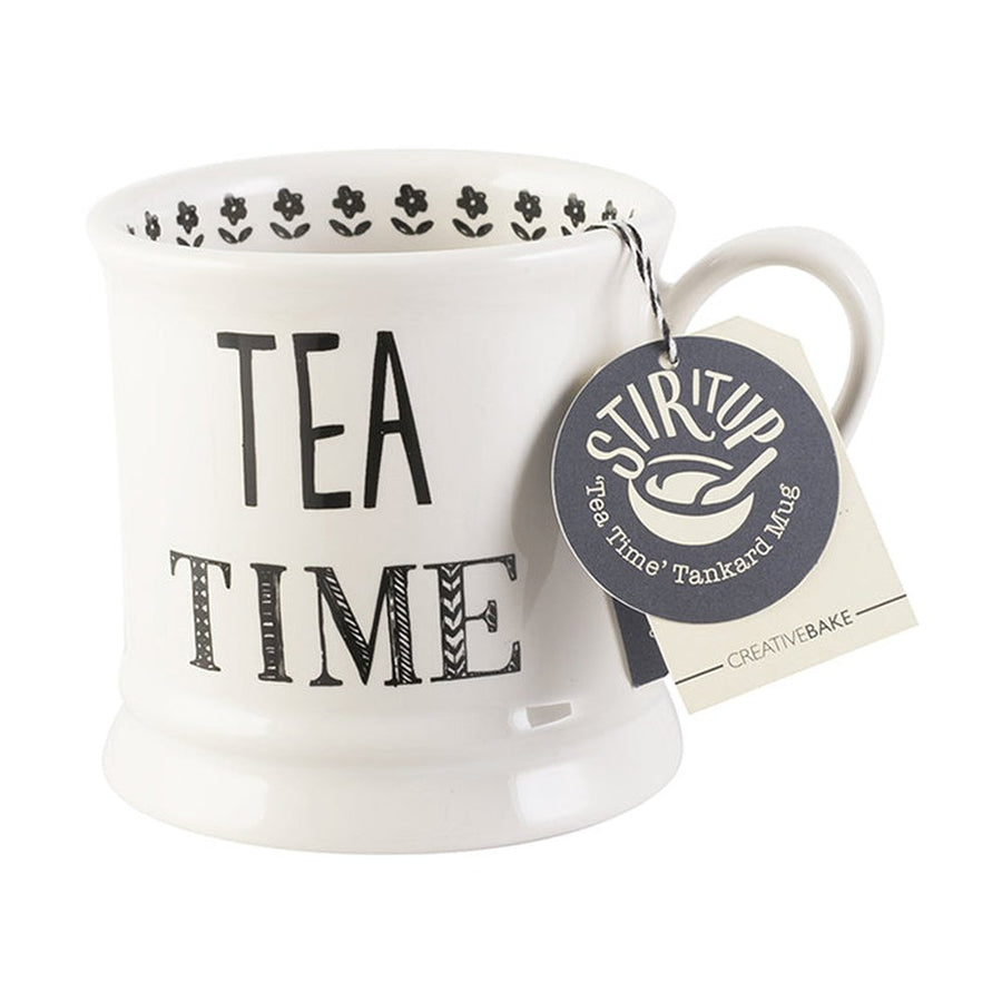 White Stir it Up ceramic mug with Tea Time inscription and an attached round tag.