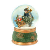 Exkluzív megjelenésű, 10 cm átmérőjű és 14 cm magas, karácsonyi zenélő-forgó hógömb, fenyőfával megrakott, talicskát toló viktoriánus korabeli apukával és kislányával.