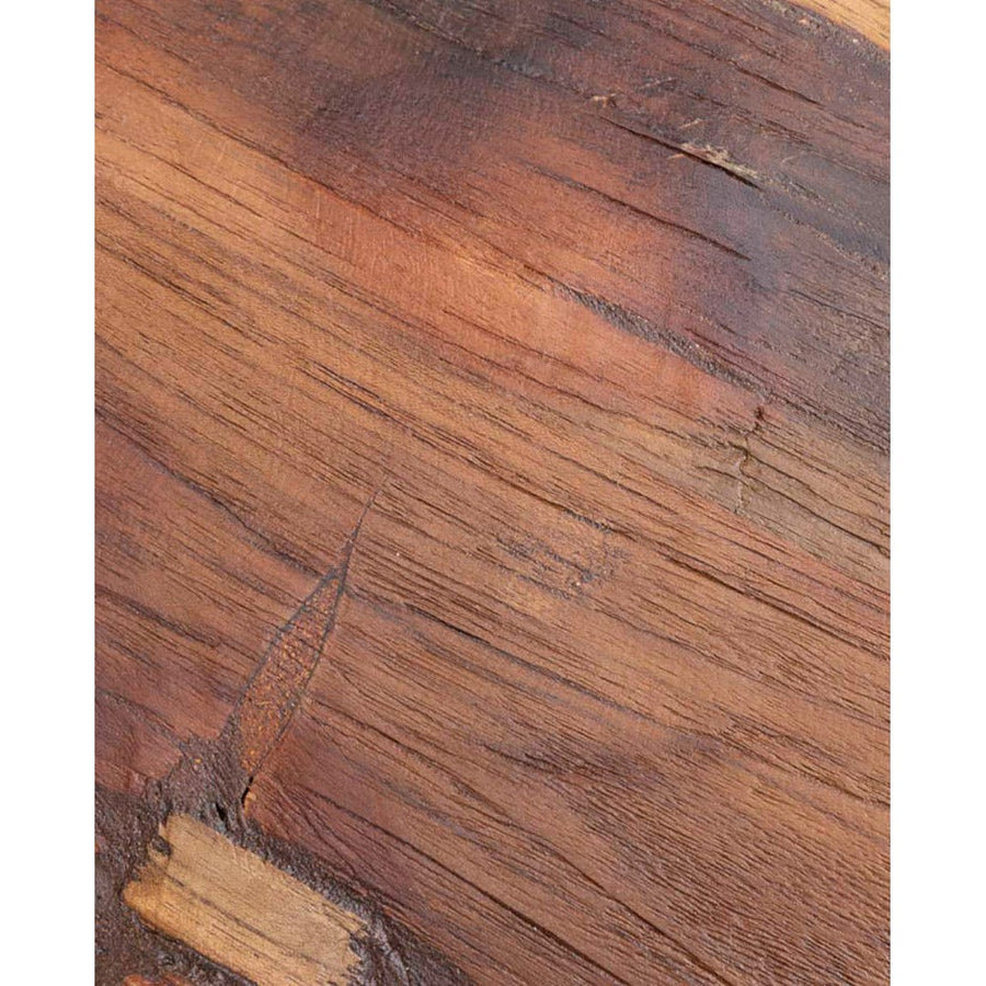 Teak wood grain close-up with warm reddish brown tones and natural texture