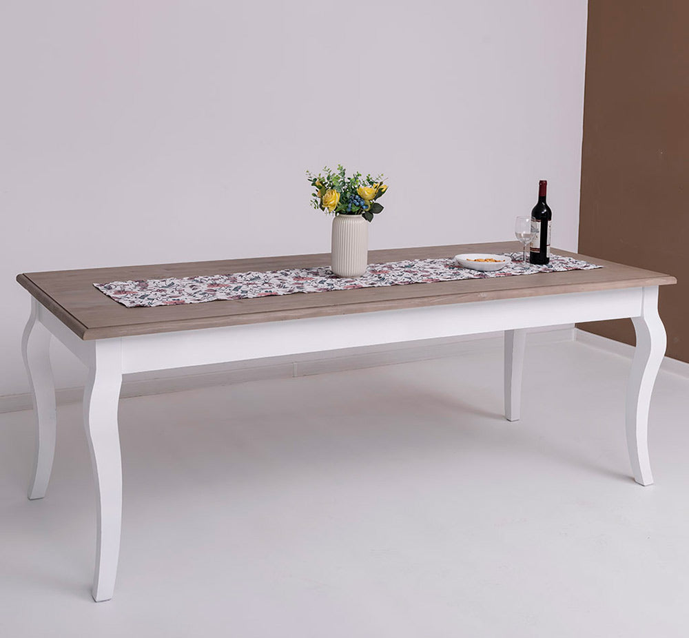 Vidéki stílusú, fehér színű fenyőfa étkezőasztal natúr lakkozott asztallappal.