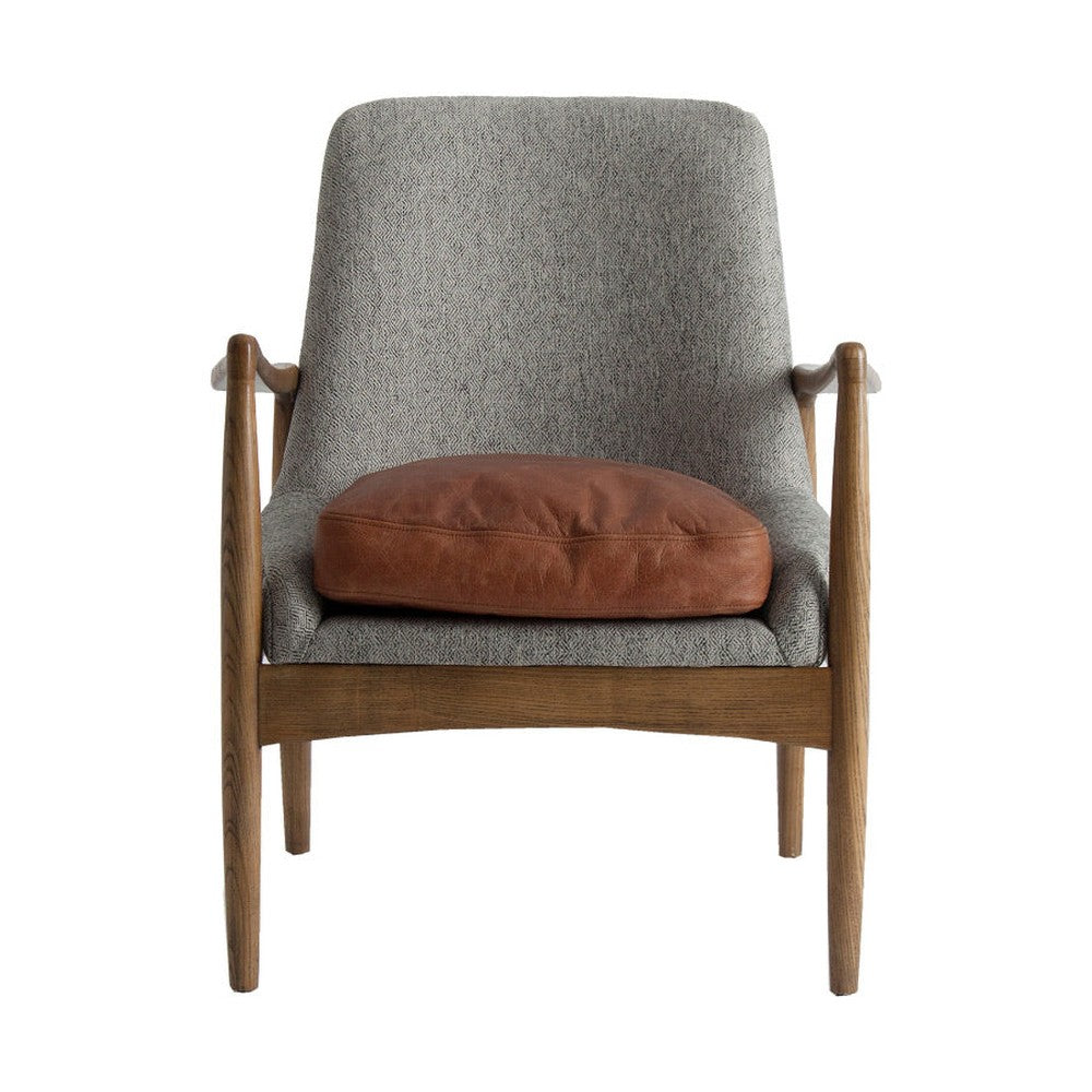 Loft stílusú, jegenyefenyőből készüt, szürke színű mintás textíliával kárpitozott fotel bőr párnával.