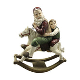 Prémium kategóriás, nagyméretű, 55 cm magas, antikolt felületű, vintage stílusú karácsonyi hintaló Télapóval és kisfiúval