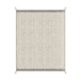 Bézs színű gyapjú szőnyeg.