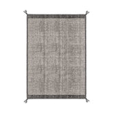 Szürke színű gyapjú szőnyeg.