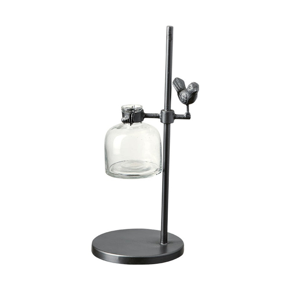 Loft stílusú,, madárral díszített, fém lombikállványba helyezett üveg váza.
