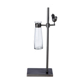 Loft stílusú,, madárkával díszített, fém lombikállványba helyezett üveg váza.